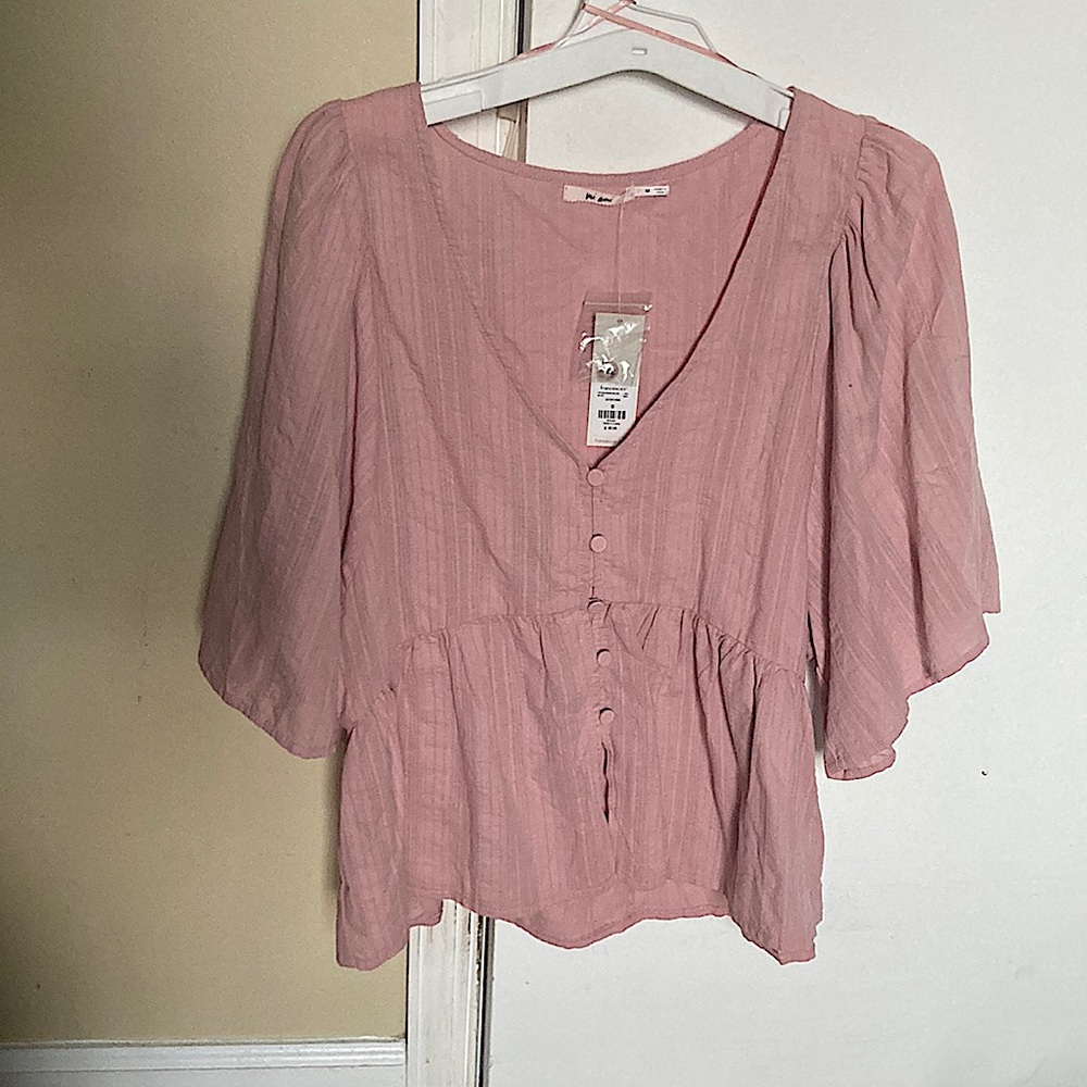 Pink wide sleeved button down blouse